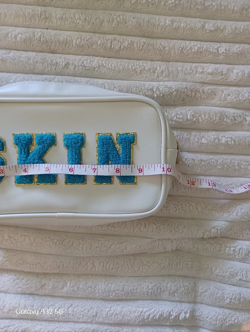 Neutrogena White Makeup Bag with Blue 'SKIN' Chenille Patch